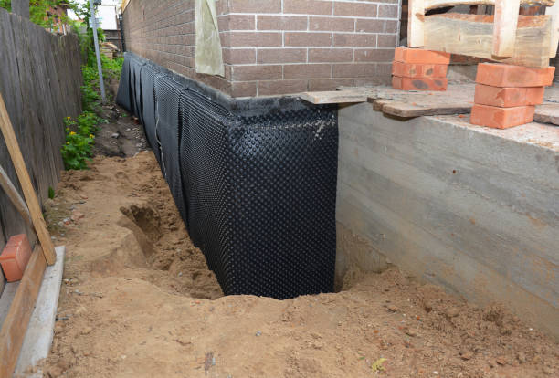 Happy homeowners after waterproofing job in Tallmadge